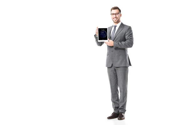 Adult smiling businessman holding ipad tablet isolated on white — Stock Photo