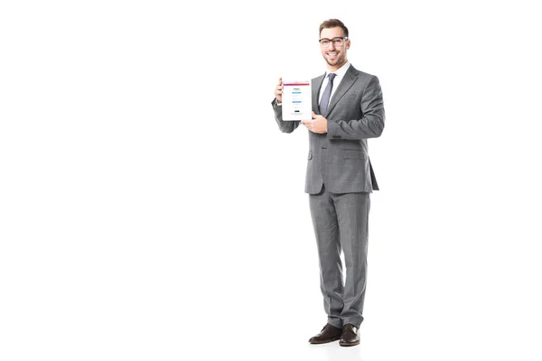 Adult businessman holding digital tablet with instagram app on screen isolated on white — Stock Photo