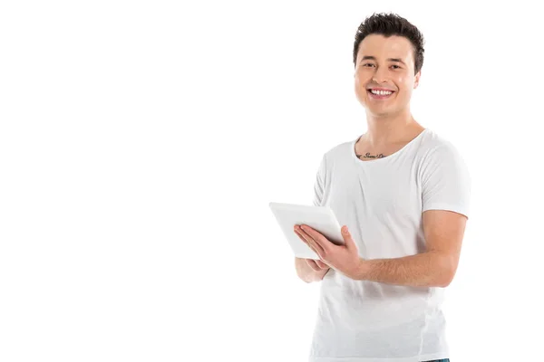 Handsome man using digital tablet and looking at camera isolated on white — Stock Photo