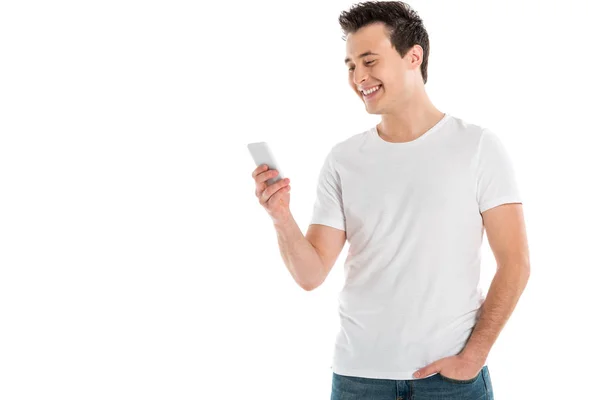 Homem bonito alegre usando smartphone isolado no branco — Fotografia de Stock