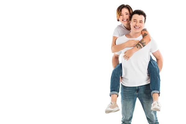 Marido feliz dando passeio de piggyback para a esposa isolada no branco — Fotografia de Stock