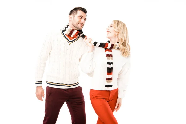 Happy adult couple in knitted scarfs having fun isolated on white — Stock Photo