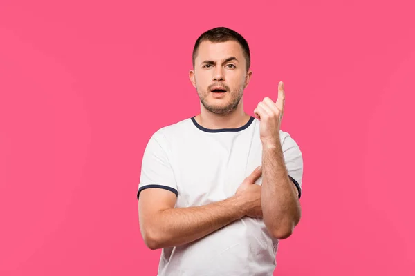 Handsome young man doing idea gesture isolated on pink — Stock Photo