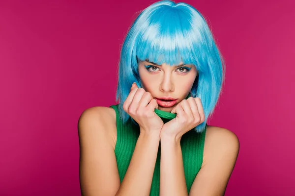 Fashionable charming girl posing in blue wig and green turtleneck, isolated on pink — Stock Photo