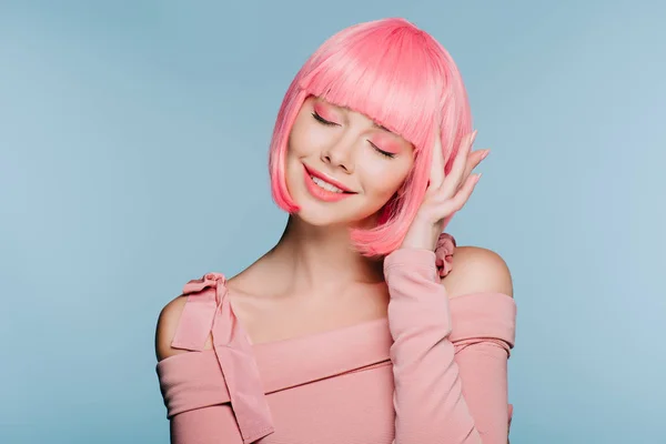 Beautiful dreamy girl with closed eyes and pink hair isolated on blue — Stock Photo