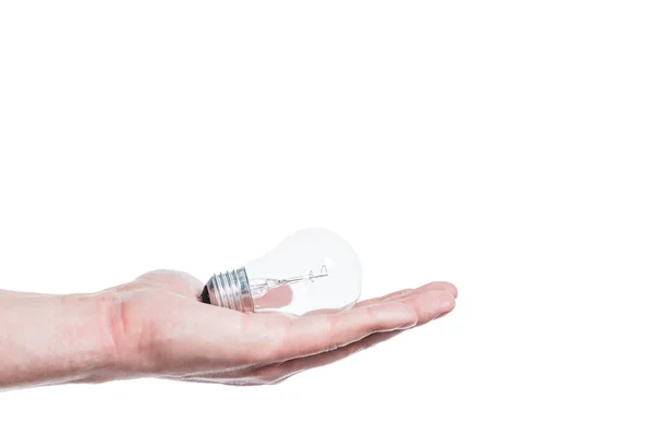 Visão recortada da mão masculina com lâmpada isolada em branco, conceito de eficiência energética — Fotografia de Stock