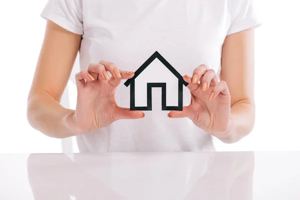 Partial view of woman holding house model in hands isolated on white, mortgage concept — Stock Photo