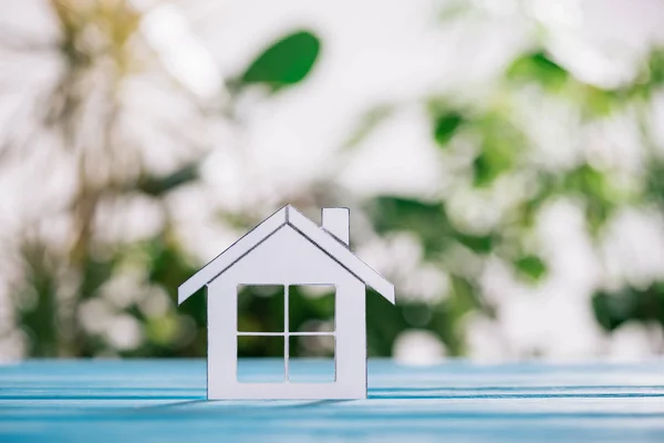 Selective focus of paper house on blue wooden desk, mortgage concept — Stock Photo