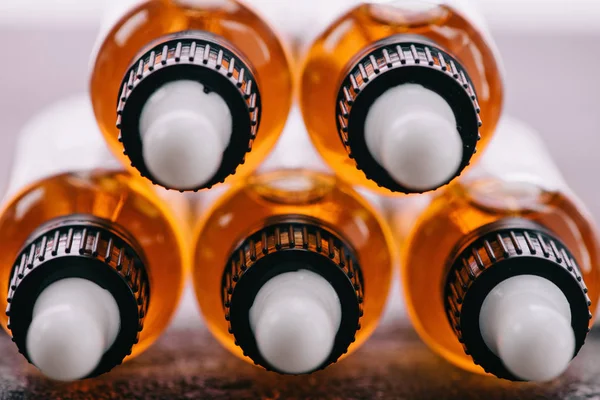 Close up of bottles with natural medicinal cbd oil and droppers — Stock Photo