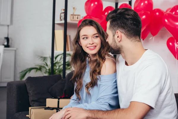 Loving young couple celebrating valentines day at home — Stock Photo