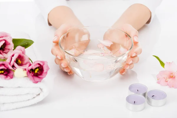Partial view of manicurist using bowl with water for nail bath — Stock Photo