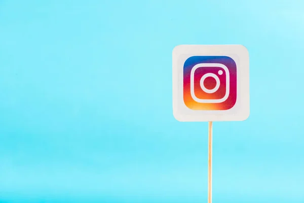 Top view of instagram logo solated on blue with copy space — Stock Photo