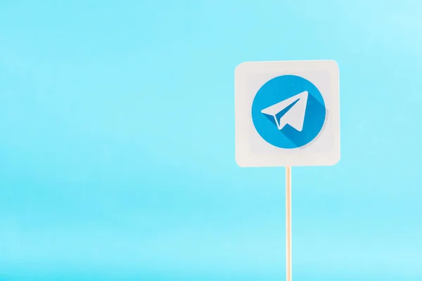 Top view of telegram icon isolated on blue with copy space — стокове фото