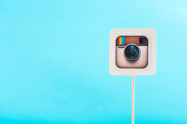 Top view of instagram icon isolated on blue with copy space — Stock Photo