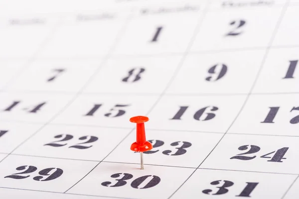 Selective focus of red pin marking number 30 in calendar — Stock Photo