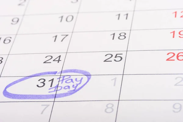 Selective focus of calendar with marked number 31 and 'pay day' lettering — Stock Photo