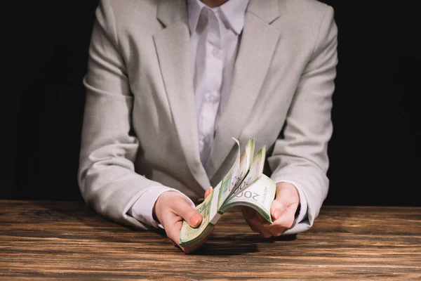 Cropped shot of businesswoman holding and counting russian rubles banknotes — Stock Photo