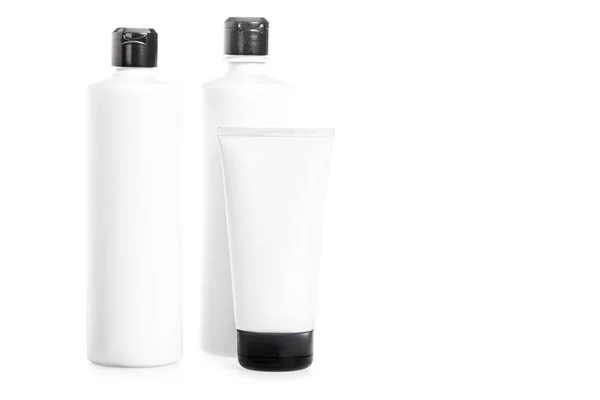 Studio shot of plastic bottles and tube isolated on white — Stock Photo