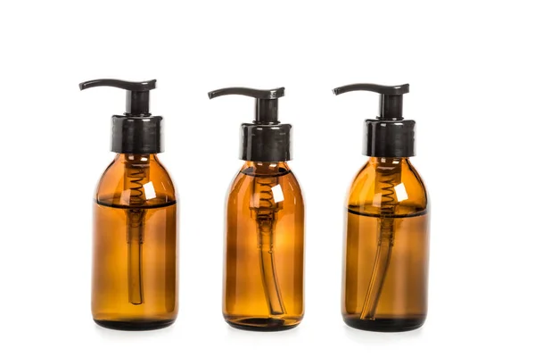 Studio shot of bottles with liquid soap isolated on white — Stock Photo