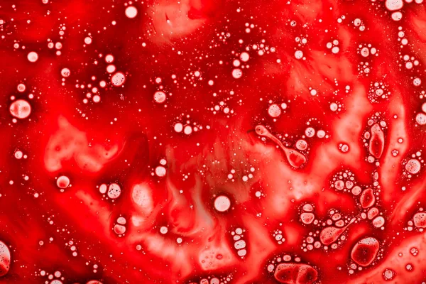 Studio shot of red liquid with bubbles — Stock Photo