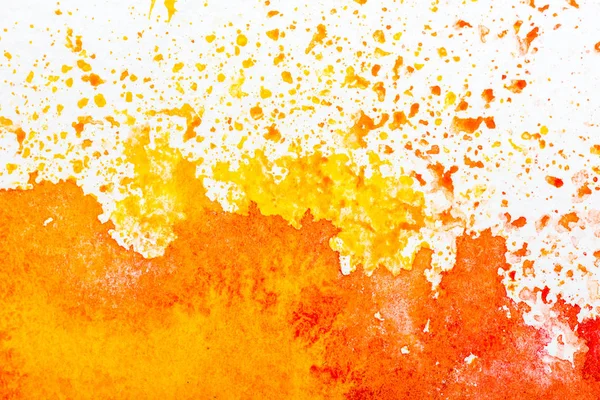 Top view of yellow and orange watercolor spills on white background — Stock Photo