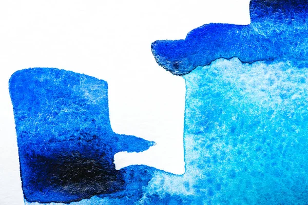 Top view of blue watercolor spill on white background with copy space — Stock Photo