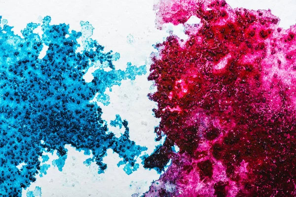 Top view of blue and pink watercolor spills on white background — Stock Photo