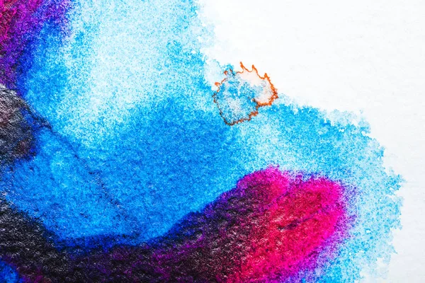 Top view of blue and pink watercolor spills on white paper — Stock Photo