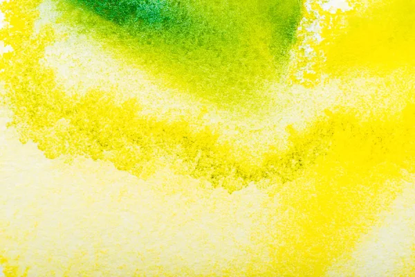 Vista superior de los derrames de acuarela amarillo y verde con espacio de copia - foto de stock