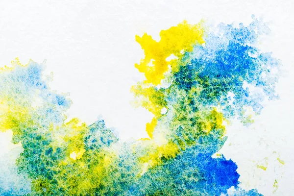 Top view of blue and yellow watercolor spills on white background — Stock Photo