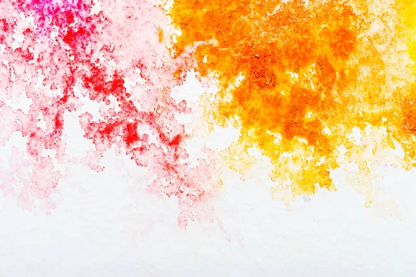 Top view of red and orange watercolor spills on white background — Stock Photo
