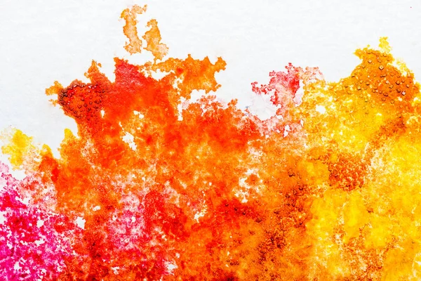 Top view of orange and yellow watercolor spills on white background — Stock Photo