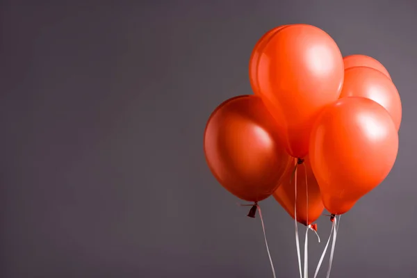 Coral air balloons on grey background, color of 2019 concept — Stock Photo