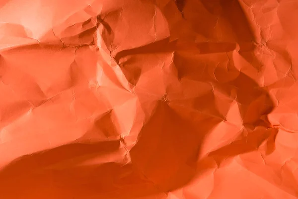 Crumpled paper textured coral surface, color of 2019 concept — Stock Photo