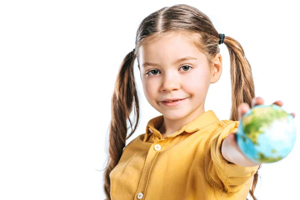 Selective focus of adorable kid holding globe model in stretched hand isolated on white, earth day concept — Stock Photo