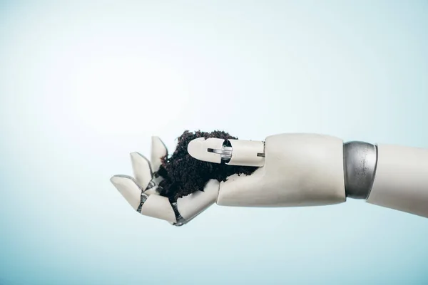 Роботизированная рука с черной поверхностью на двухцветном фоне, концепция дня Земли — стоковое фото