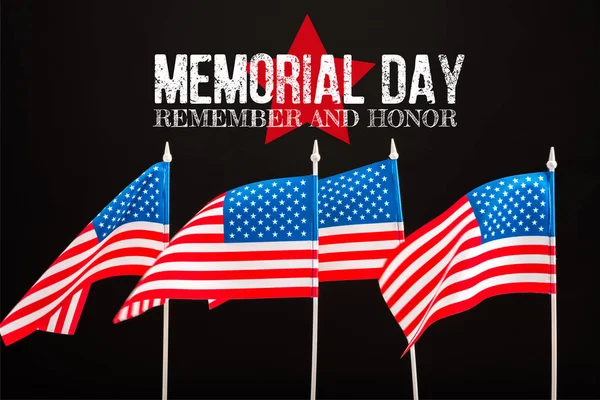 American flags with memorial day lettering isolated on black — Stock Photo