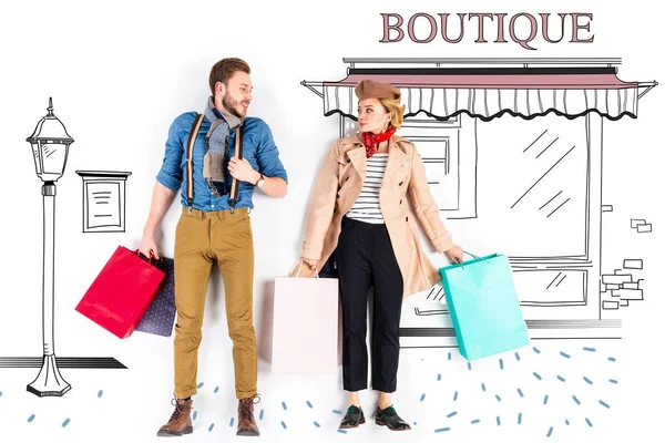 Elegant couple holding shopping bags with boutique illustration on background — Stock Photo