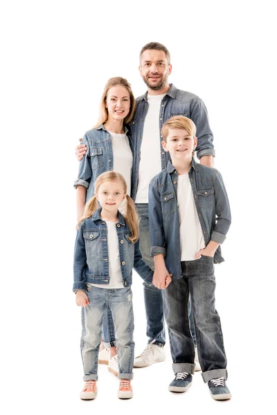 Full length view of smiling family in jeans embracing and holding hands isolated on white — Stock Photo