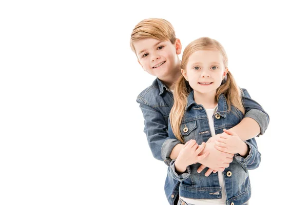 Happy kids embracing and looking at camera isolated on white — Stock Photo