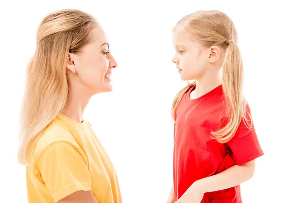 Side view of happy mother and daughter looking at each other isolated on white — Stock Photo