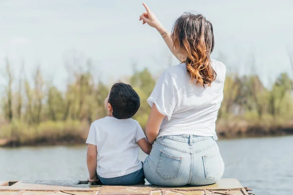 Back View Mother Pointing Finger Sitting Son — Stock Photo, Image