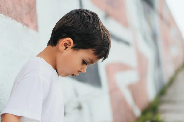 Side view of cute boy looking down — Stock Photo