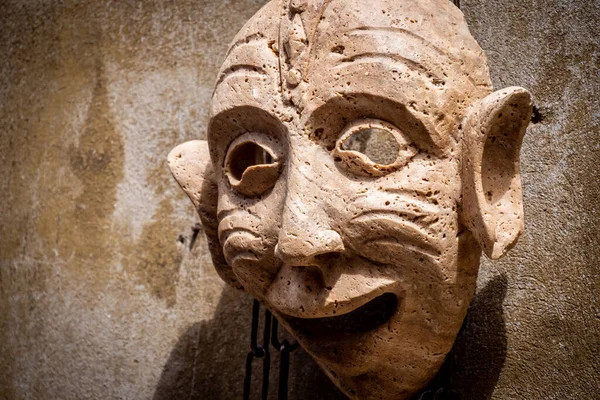 Terracotta face mask shaped like a demon. Italian handmade art — Stock Photo, Image