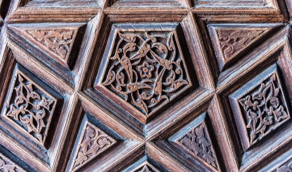 Details of a fine wood carving art on the door. An Islamic art and craft.