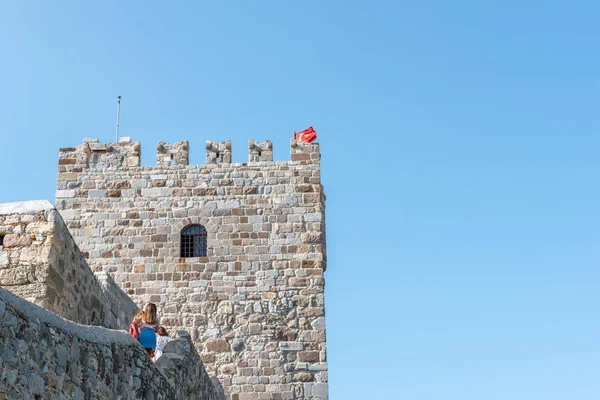 Unidentified people walk and explore in Castle of St. Peter or Bodrum Castle, Turkey.