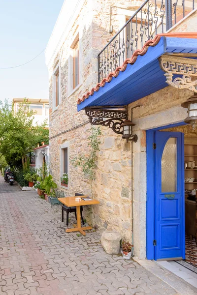 Narrow streets of Bodrum  with cafe table and chairs  i