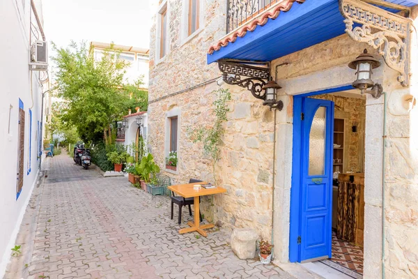 Narrow streets of Bodrum  with cafe table and chairs  i