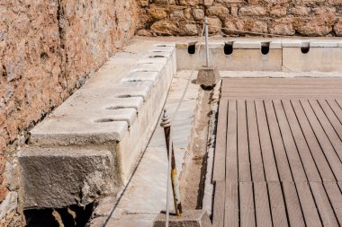 Public Toilets,Latrines, Ruins in Ephesus historical ancient city, in Selcuk,Izmir,Turkey. clipart