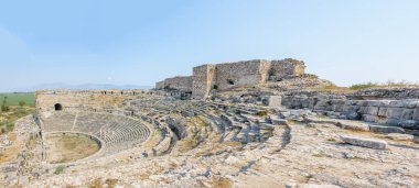 Exterior high resolution panoramic view of Theater in Miletus Ancient Greek City in Didim,Aydin,Turkey. clipart